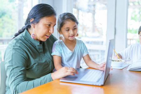 guardian doing homework with children