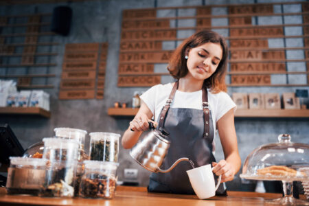 teens and taxes - young girl pouring coffee