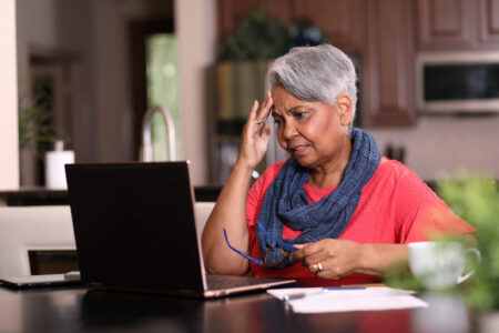 woman trying to figure out how to pay off tax debt