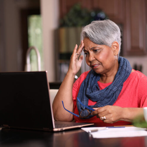 woman trying to figure out how to pay off tax debt