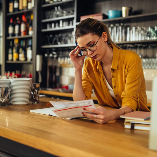 woman worried about business back taxes