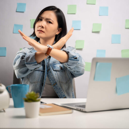 woman warning about employer tax mistakes to avoid