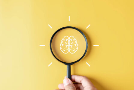 brain and magnifying glass
