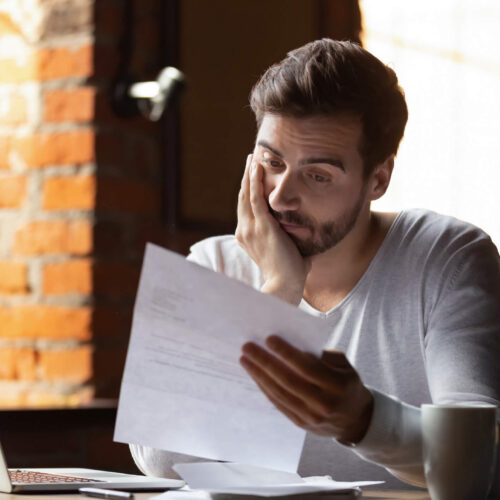 man reading irs levy notice
